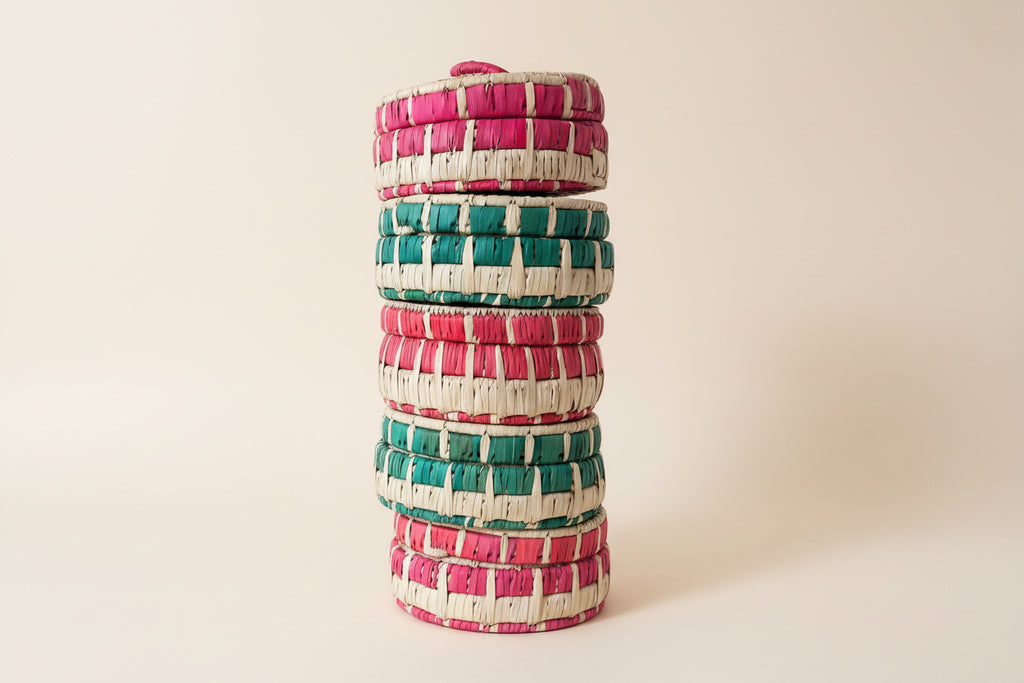a stack of handmade baskets with lids
