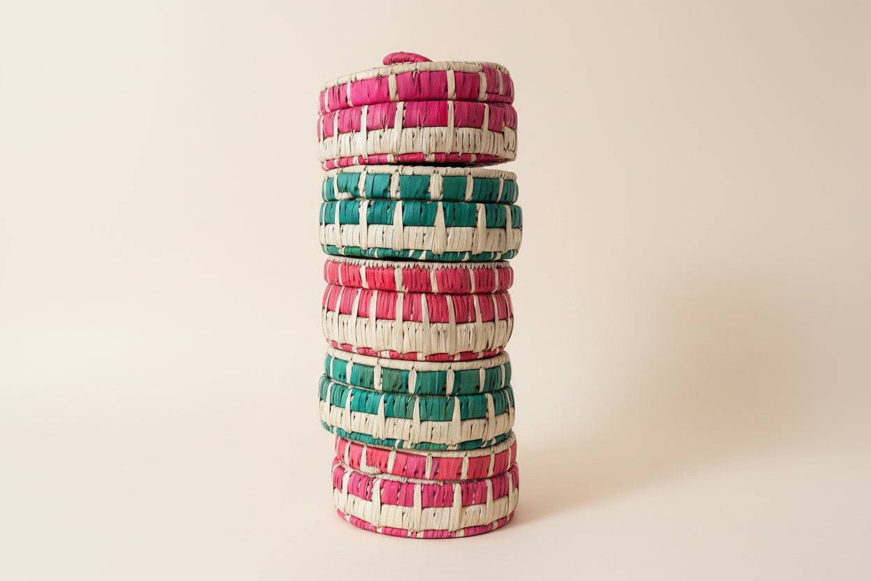 a stack of handmade baskets with lids
