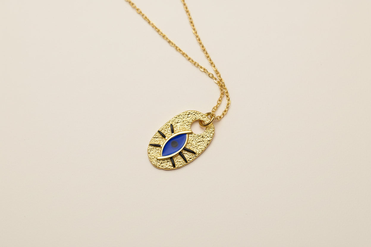 Golden Pendant with a blue eye 