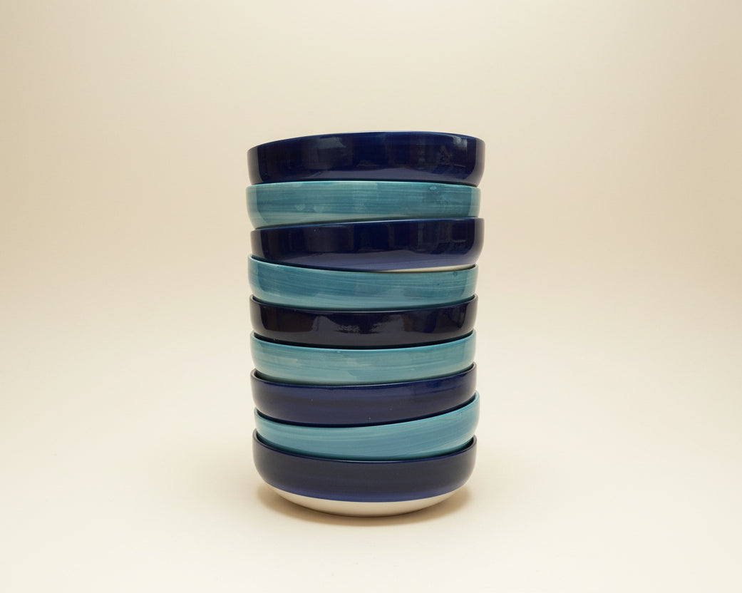 Stack of blue and light blue bowls