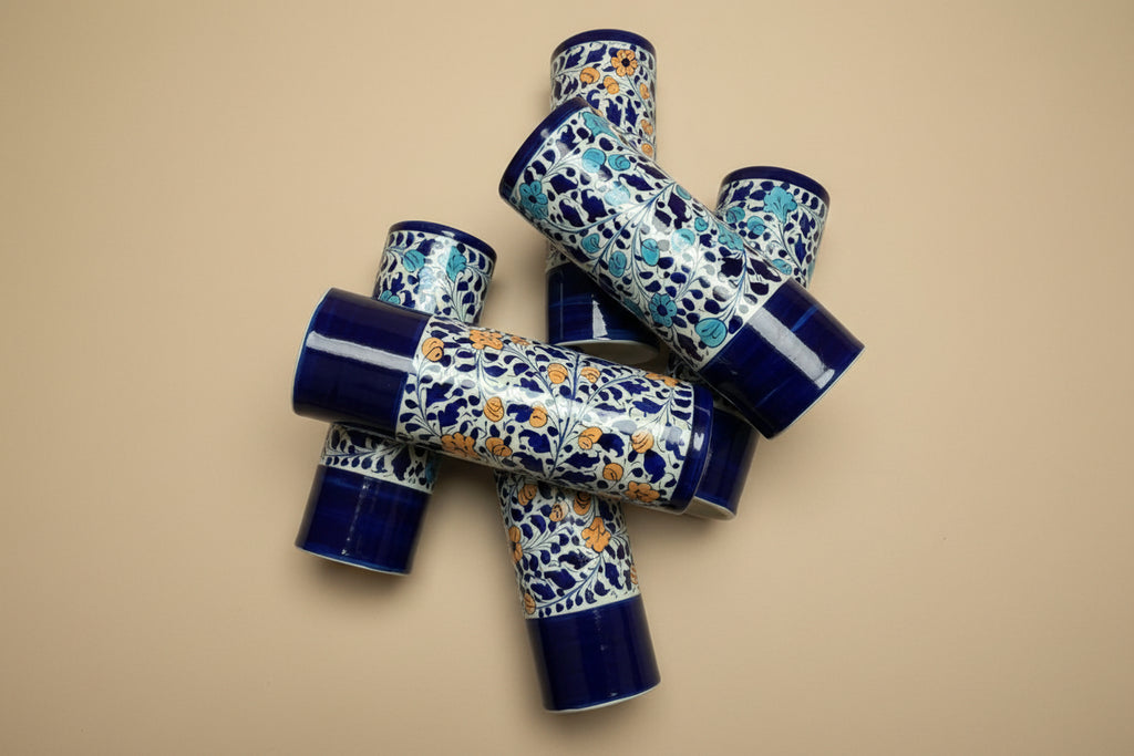 A collection of vases in blue white and orange
